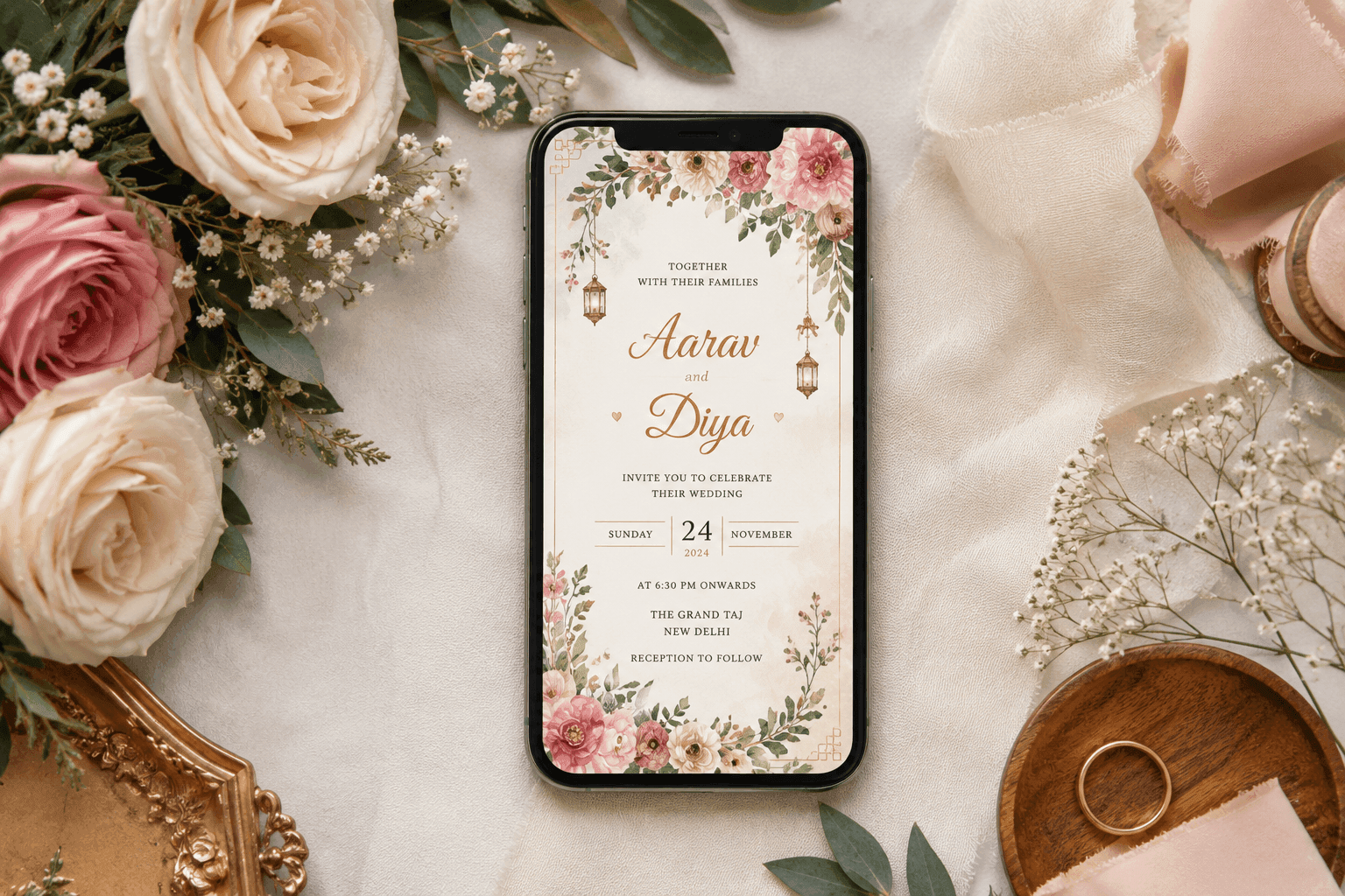 Floral digital wedding invitation displayed on a flat-lay phone screen.